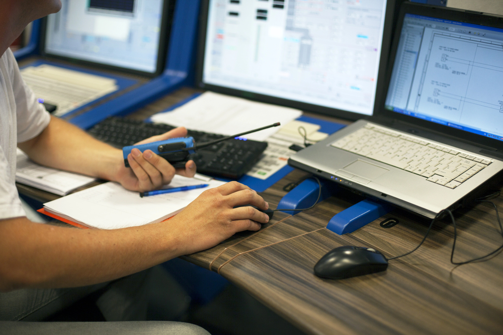 Technician troubleshooting automation system in control room