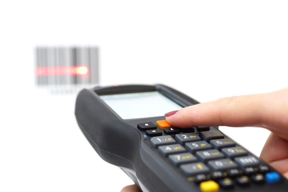 Operator scanning barcodes for product traceability