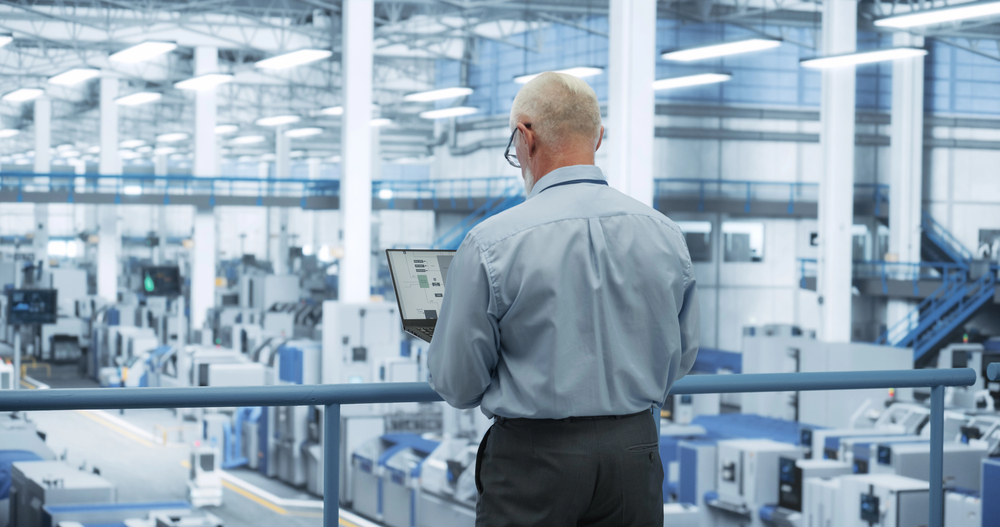 Engineer upgrading software on industrial control system